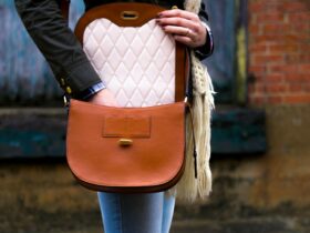 woman wearing red leather crossbody bag