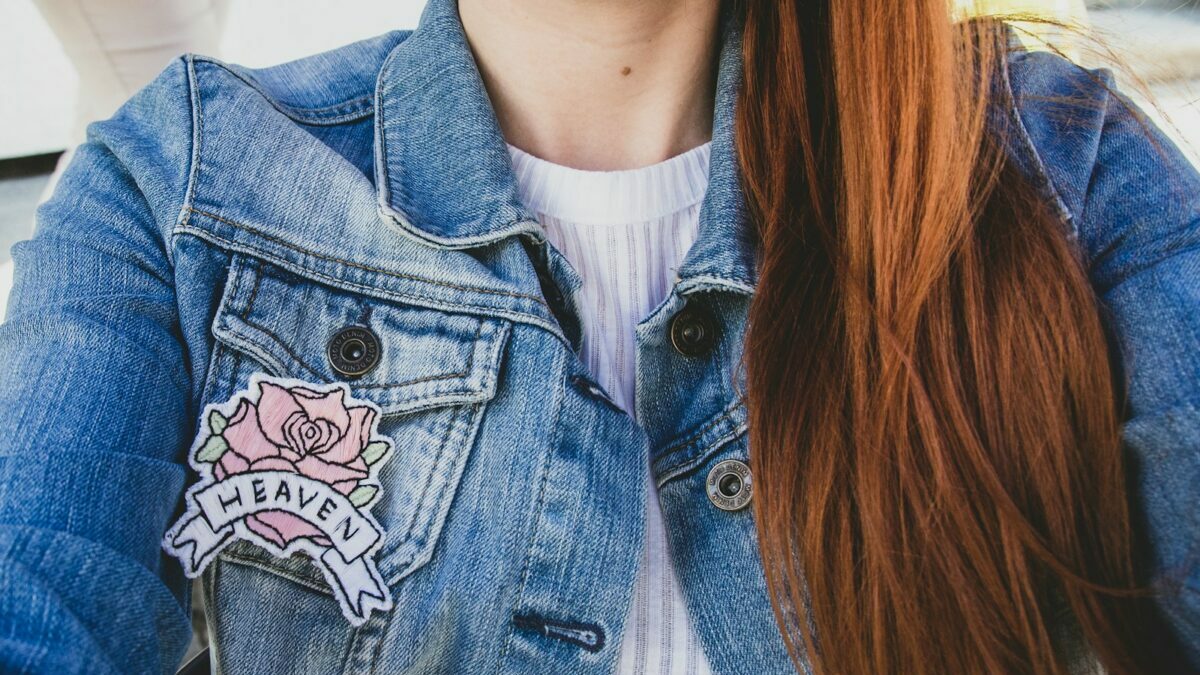 woman wearing blue denim faded jacket