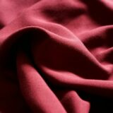 a close up view of a red fabric