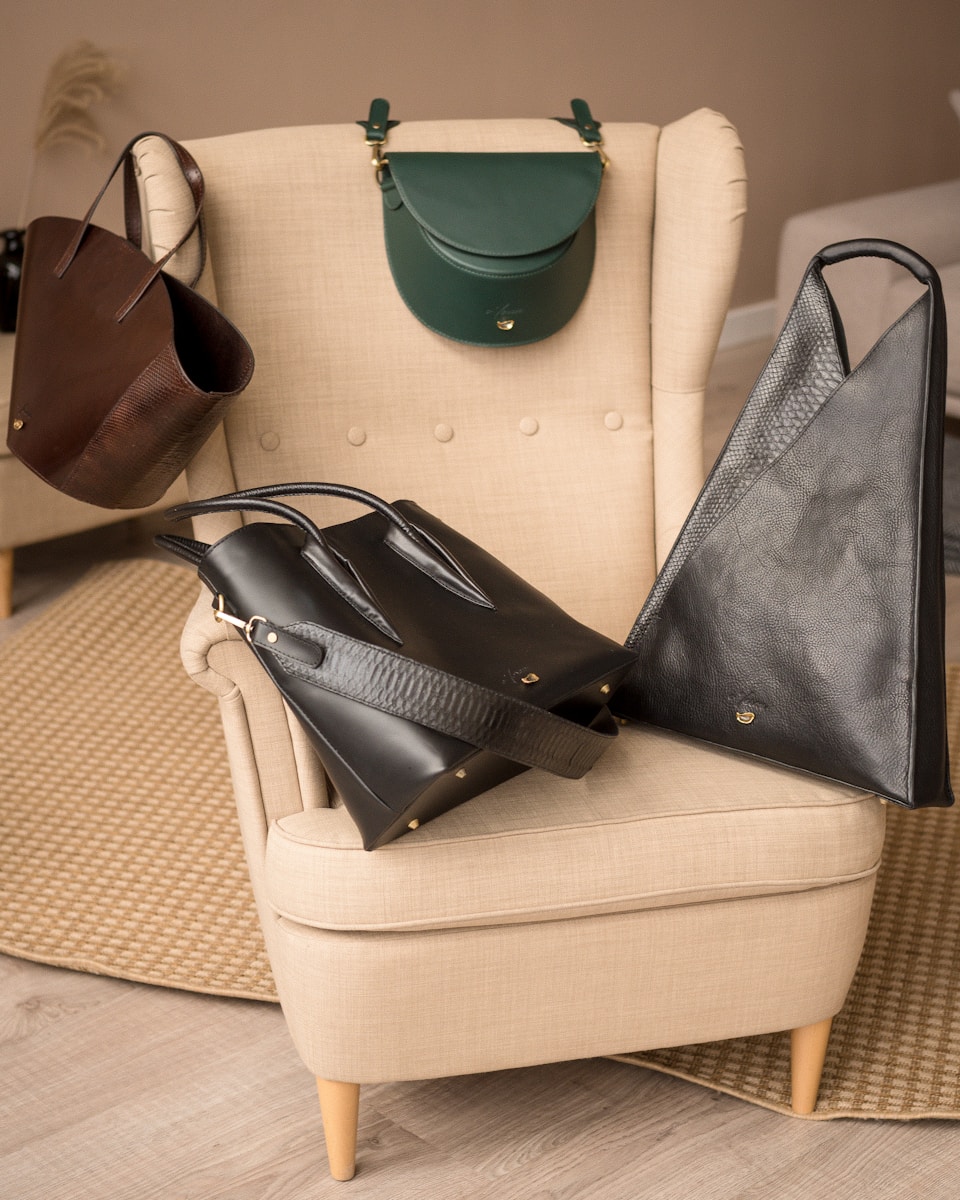 a chair with a bunch of purses on top of it